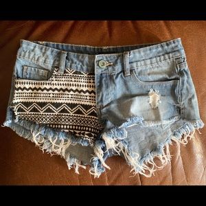 Women’s distressed denim shorts